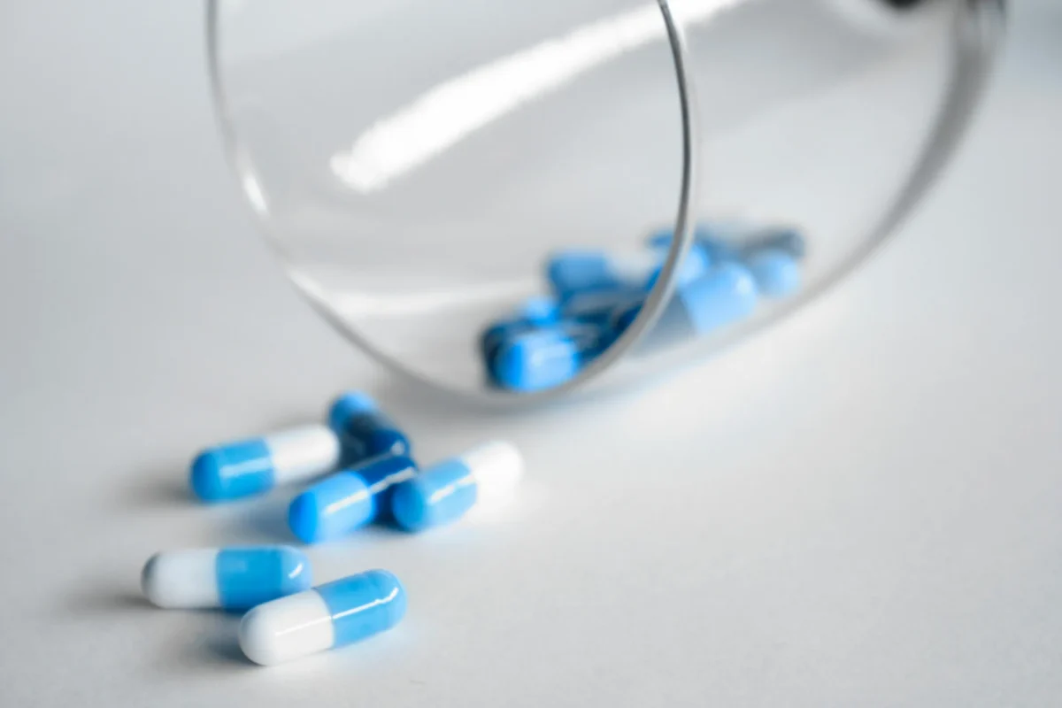 picture of medicinal drugs on a flat surface for a blog about regulatory affairs in clinical trials